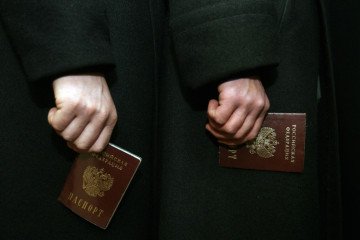 Russia Considers Revoking Residency for Relatives of Foreign Soldiers Seeking Political Change Passports of the Russian Federation. (Source: Getty Images)