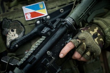 Polish legionary of the Ukrainian Foreign Legion, call sign Baks, 25 years old, holds a rifle on March 15, 2024 in Kostiantynivka, Ukraine. (Source: Getty Images)