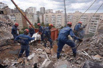 Emergency responders work at the site of a collapsed apartment building in Kyiv following Russia's overnight missile and drone strike on July 6, 2026. (Source: State Emergency Service)