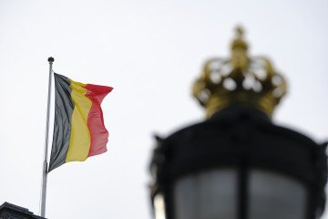 The Belgian flag flies above the Brussels Royal Palace in Brussels, Belgium. (Source: Getty Images)