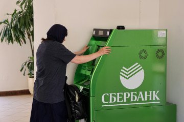 A customer uses a Sberbank PJSC ATM in Moscow, Russia.