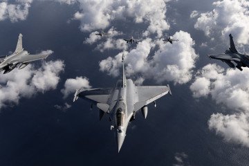 French Air Force Rafale fighter jets and two Greek air force fighter jets F-16, and a French Air Force Mirage 2000 D fly over the southwestern coasts of France on September 26, 2025. (Source: Getty Images)