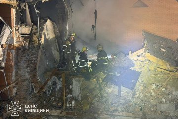 Firefighters at the scene of a Russian drone strike in Vyshneve, September 1, 2026.