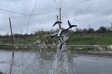Remains of a drone hang on anti-drone net on Kostiantynivka-Kramatorsk road on April 24, 2026 in Donetsk region, Ukraine. (Source: Getty Images)