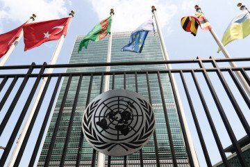 United Nations emblem is seen at the United Nations Headquarters building in New York City, United States on July 16, 2024. (Photo by Jakub Porzycki/NurPhoto via Getty Images)