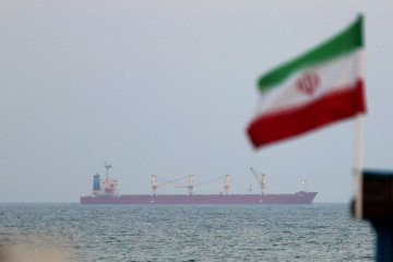 A picture taken on April 29, 2023, shows a shipping vessel sailing past Iran’s Gulf island of Qeshm. Illustrative image. (Source: Getty Images)