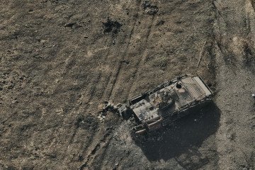 An aerial view of bodies of Russian soldiers and a destroyed Russian armored vehicle after the assault on a small settlement of Tsukurine, Ukraine. (Source: Getty Images)
