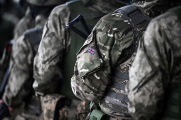A Union Jack flag is pictured on the sleeve uniform of a soldier during a training excercise operated by Britain's armed forces as part of the Interflex programme for Ukrainian soldiers, in southern England, on August 22, 2024. (Source: Getty Images)