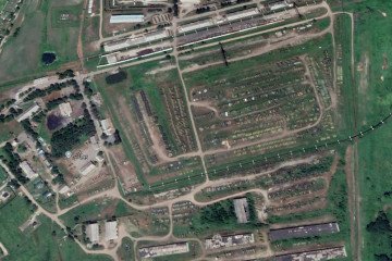 A wide-angle satellite view shows the 7004th military storage base in Russia’s Far East. Rows of MT-LB armored vehicles, once densely packed, are now visibly sparse or missing, consistent with reports of large-scale equipment withdrawals. (Source: Jompy)