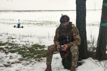 A soldier from the 13th Khartiia Brigade of Ukraine’s National Guard wears a headset to fly an FPV drone during the tests of the net gun used to combat FPV-type UAVs in Ukraine, on January 7, 2026. (Source: Getty Images)