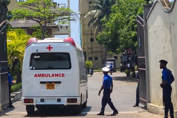 An ambulance arrives at Sri Lanka’s southern naval headquarters in Galle on March 4, 2026, to transport Iranian sailors rescued after the Iranian frigate IRIS Dena sank off the island’s coast. (Source: Getty Images)