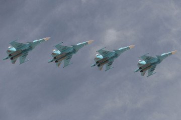 Sukhoi Su-34 Fullback tactical bombers fly during the military parade on May 9, 2015 in Moscow, Russia. (Source: Getty Images)