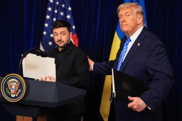 US President Donald Trump and Ukrainian President Volodymyr Zelenskyy leave a press conference following their meeting at Trump’s Mar-a-Lago club on December 28, 2025 in Palm Beach, Florida. (Source: Getty Images)