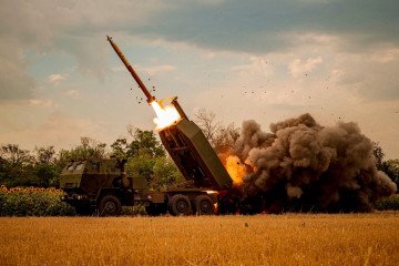 Ukrainian HIMARS missile launcher firing a missile. Ukrainian HIMARS missile launcher firing a missile.