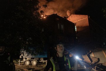 A Ukrainian police officer inspects the area near a burning building struck by a drone following a Russian air attack on Kyiv late on July 2, 2026. (Source: Getty Images) A Ukrainian police officer inspects the area near a burning building struck by a drone following a Russian air attack on Kyiv late on July 2, 2026. (Source: Getty Images)