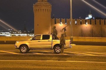 Russian soldiers stand guard in front of the Kremlin with a mounted machine gun on a Chinese-made pickup truck during overnight anti-drone patrols in Moscow, October 26–27, 2025. (Source: Russian media)
