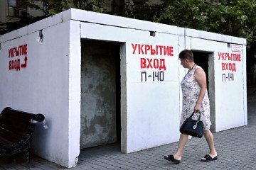A woman walks past a bomb shelter in Sevastopol, the main base for Russia’s Black Sea Fleet, in the Crimean peninsula, on July 22, 2026. A woman walks past a bomb shelter in Sevastopol, the main base for Russia’s Black Sea Fleet, in the Crimean peninsula, on July 22, 2026.