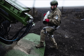 Ukrainian artilleryman loading a shell in the 2S22 Bohdana artillery system, wearing an exoskeleton in the Pokrovsk direction, March 2026. (Source: 7th Air Assault Corps)