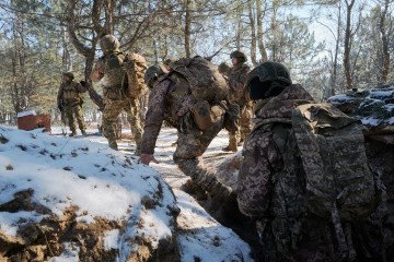 Recruits of the Ukrainian Armed Forces undergo combat tactical training in trenches in the Donetsk region. (Photo by Pierre Crom/Getty Images)