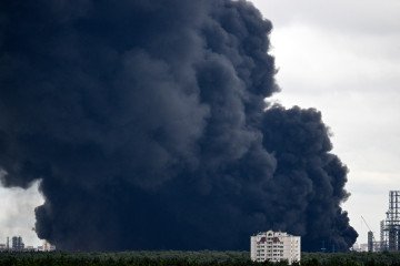 Ukrainian Drones Strike 10 Energy Sites Across Occupied Territories as Campaign Total Reaches 187 Targets Black smoke rises from the area of the Russian oil producer Gazprom Neft's Moscow oil refinery. (Source: Getty Images)