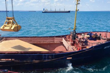Grain is loaded aboard a cargo ship at the Azov Sea Port, Rostov region, Russia. (Source: Getty Images)