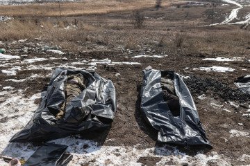 Volunteers from the Ukrainian organization Platsdarm recover and transport the bodies of deceased Russian soldiers from former combat positions in Donetsk region for identification and eventual repatriation to Russia, March 2, 2025. (Photo: Getty Images)