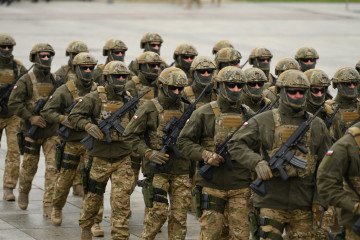 Soldiers of the special forces NIL parade during the Independence Day celebrations in front of the Tomb of the Unknown Soldier at Pilsudski Square in Warsaw, Poland, on November 11, 2025. (Source: Getty Images)