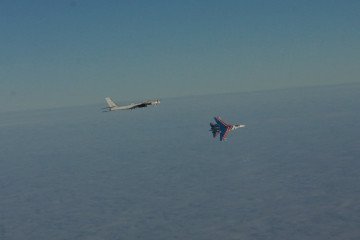 Russian Tu-95 Bear-H strategic bomber flies over the Barents Sea escorted by a Su-35 fighter jet painted in the colors of the “Russian Knights” aerobatic team. (Source: Norwegian Armed Forces)