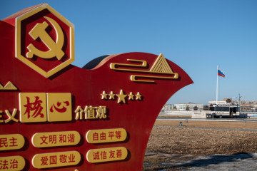 A Russian flag in Blagoveshchensk, Russia, across from the Amur River in Heihe, Heilongjiang province, China, on Monday, March 20, 2023. (Source: Getty Images)