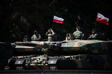 ‘Pre-War State’ Is Poland’s New Security Concept, With Warsaw Drafting Legislation to Counter Hybrid Threats Several Polish Army Leopard 2PL main battle tanks carrying Polish national flags. (Source: Getty Images)