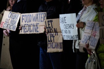 Activists hold placards with slogans during a rally in support of residents of Oleshky, Kherson region, near the diplomatic mission of the Holy See in Kyiv, Ukraine, on October 6, 2026. (Source: Getty Images) Activists hold placards with slogans during a rally in support of residents of Oleshky, Kherson region, near the diplomatic mission of the Holy See in Kyiv, Ukraine, on October 6, 2026. (Source: Getty Images)