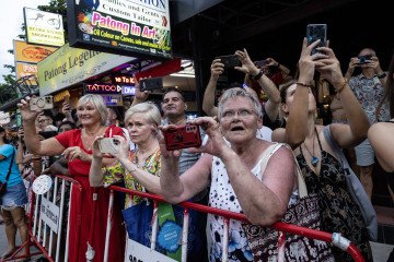 Russian tourists watch a parade along Patong Beach in Phuket, Thailand. (Source: Getty Images) Russian tourists watch a parade along Patong Beach in Phuket, Thailand. (Source: Getty Images)