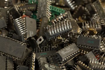 Recycled microchips and electrical components to be used for gold material salvage sit in a container at the JSC Krastsvetmet non-ferrous metals plant in Krasnoyarsk, Russia. (Source: Getty Images)