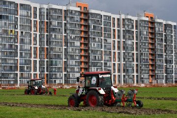 Russia's Agricultural Sector Faces Crisis as Machinery Shortage Threatens Crop Yields Tractor drivers compete in a ploughing championships during the Russian Agricultural Festival in Murino, Leningrad region on August 8, 2025. (Source: Getty Images)