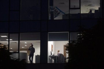 Foreign Tech Flow to Russia Plummets to Lowest Level Since the 1990s Employees work inside illuminated offices at night. Illustrative Image. (Source: Getty Images)