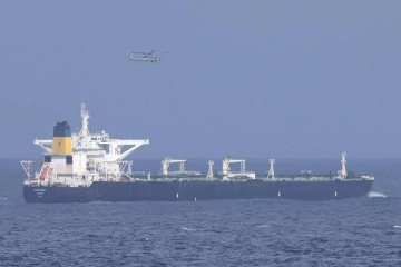 A US Coast Guard helicopter flies by Bella 1, now named Marinera, in the Caribbean Sea. (Photo: open source)