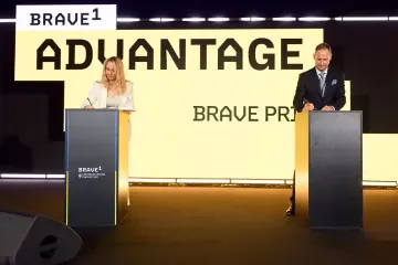 Iryna Zabolotna, COO of Brave1, and Jo Mueller, Member of the Executive Committee of Airbus Defence and Space, sign a strategic cooperation agreement under the Brave Prime initiative during the Brave1 Advantage event in Kyiv. (Source: Airbus)