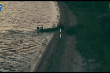 An unmanned surface vessel lands an armed ground robot on the occupied Kinburn Spit during a Ukrainian combat operation. (Source: 123rd Separate Territorial Defense Brigade) An unmanned surface vessel lands an armed ground robot on the occupied Kinburn Spit during a Ukrainian combat operation. (Source: 123rd Separate Territorial Defense Brigade)