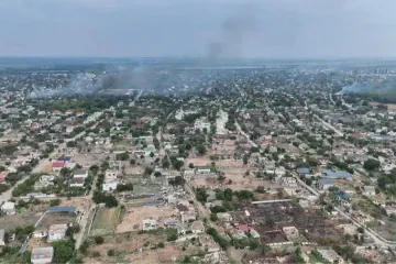 Aerial view of Oleshky, Kherson region, with smoke rising over parts of the city. Aerial view of Oleshky, Kherson region, with smoke rising over parts of the city.