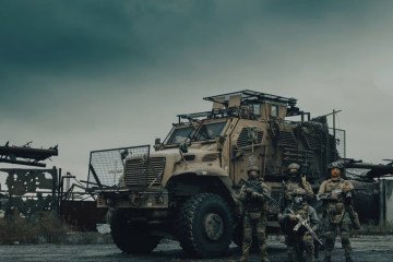 3rd Assault Corps soldiers stand in front of the International MaxxPro armored vehicle. 3rd Assault Corps soldiers stand in front of the International MaxxPro armored vehicle.