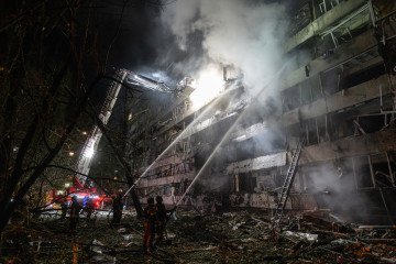 Ukrainian firefighters extinguish a blaze at the site of a Russian missile strike at an apartment building in Kyiv on October 14, 2026. Ukrainian firefighters extinguish a blaze at the site of a Russian missile strike at an apartment building in Kyiv on October 14, 2026.