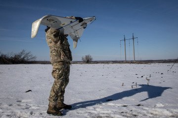 A member of the “Taifun” special operations unit of unmanned systems of the National Guard of Ukraine prepares to launch a reconnaissance drone in Kharkiv Region, Ukraine. Illustrative photo. (Source: Getty Images)
