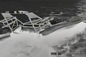 A Ukrainian uncrewed surface vessel, likely a Barracuda-class drone, seen through the camera of a Russian FPV drone. (Source: Russian media)