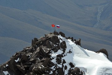 Russian and Kyrgyz flags displayed on Vladimir Putin Peak in the Tian Shan mountains near Bishkek, Kyrgyzstan. (Source: Getty Images) Russian and Kyrgyz flags displayed on Vladimir Putin Peak in the Tian Shan mountains near Bishkek, Kyrgyzstan. (Source: Getty Images)