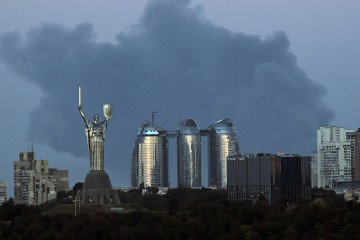 A plume of smoke from a fire in a Kyiv suburb rises behind the Motherland Monument and apartment blocks in the Pechersk district, Kyiv, Ukraine, on August 28, 2026. A plume of smoke from a fire in a Kyiv suburb rises behind the Motherland Monument and apartment blocks in the Pechersk district, Kyiv, Ukraine, on August 28, 2026.