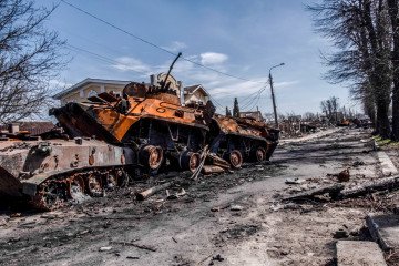 Destroyed Russian tanks remain on a street in Bucha following the town’s liberation from Russian occupation, April 2022. (Source: Getty Images)