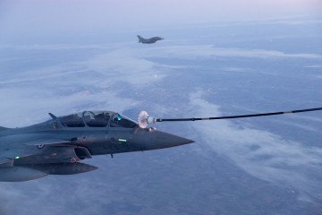 A French Air Force Rafale fighter jet refuels from an A330 MRTT Phenix military tanker aircraft during the “Poker” exercise over France on March 17, 2026.