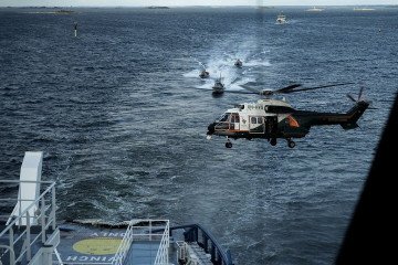 An Airbus Helicopter OH-HVG AS332L Super Puma of the Finnish Border Guard approaches the Finnish icebreaking vessel Polaris off Helsinki in the Gulf of Finland during MARSEC EU 26 joint exercise on September 17, 2026. (Source: Getty Images)
