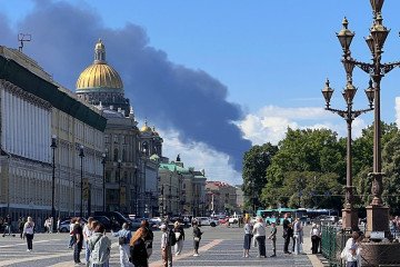 Black smoke rises after Ukrainian drone strikes against oil refineries and military targets on the opening day of the St. Petersburg International Economic Forum in St. Petersburg, Russia. (Source: Getty Images)