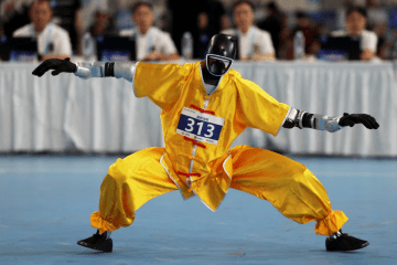 How China Is Turning Commercial Humanoid Robots Into Next-Generation Soldiers A humanoid robot takes part in a wushu contest during the second World Humanoid Robot Games at the National Speed Skating Oval in Beijing, China August 26, 2026. (Source: REUTERS)